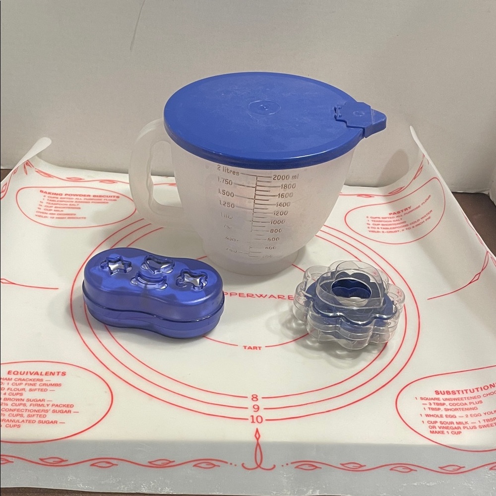 Tupperware Pastry mat, 8-cup measuring bowl and 2 sets of cookie cutters